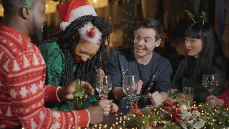 medium shot of a drunk man with his friends during christmas celebrations at a bar