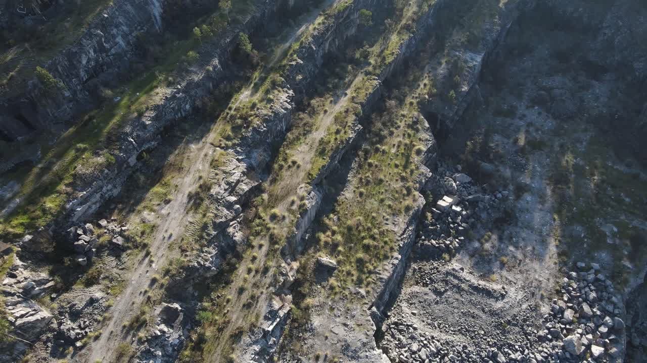 Aerial view of a abandoned quarry with the terraces