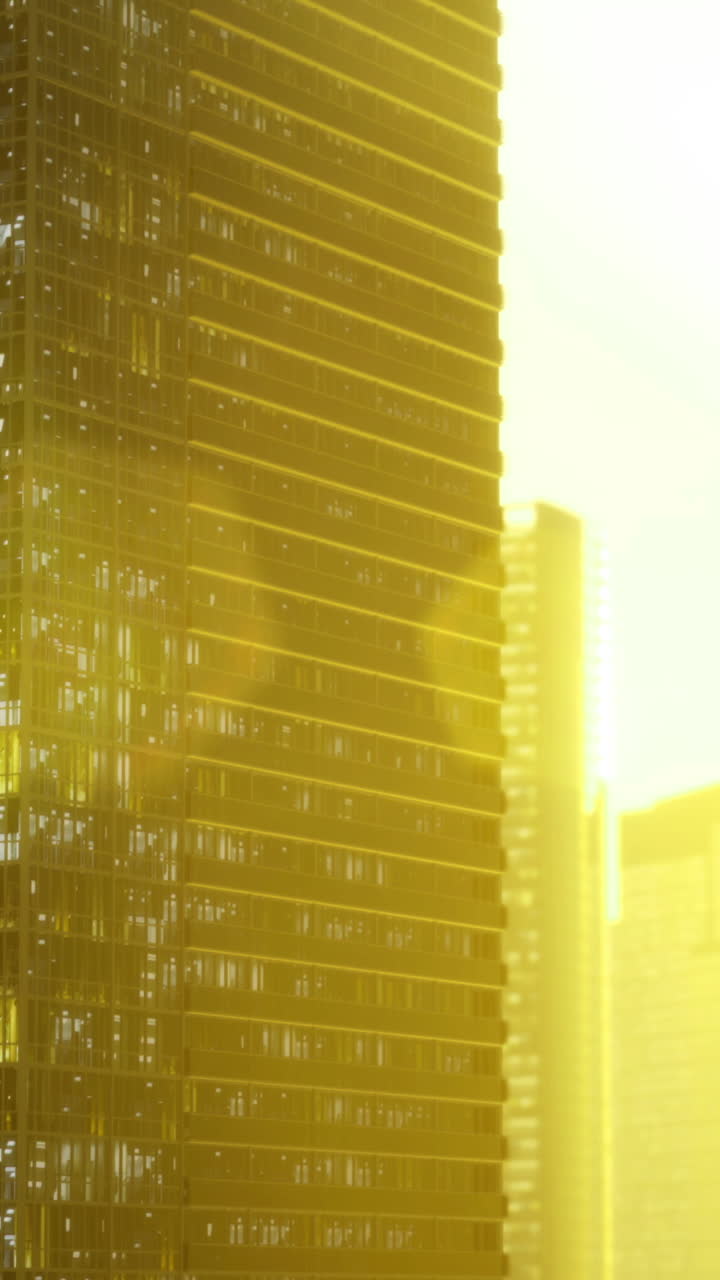 Bright morning sun illuminating modern skyscrapers in an urban landscape