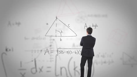 hombre pensando en ecuaciones matemáticas.