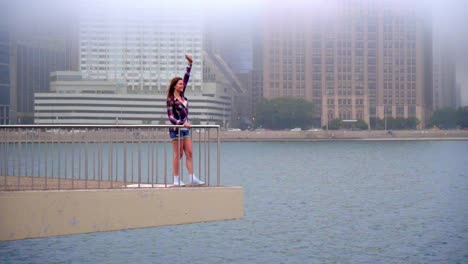 girl waving somebody in the sea. young beautiful woman waving goodbye