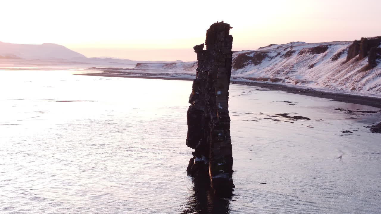 Hvitserkur is a lonely cliff on the shore far in Iceland's north. It reminds prehistoric animal turned into stone