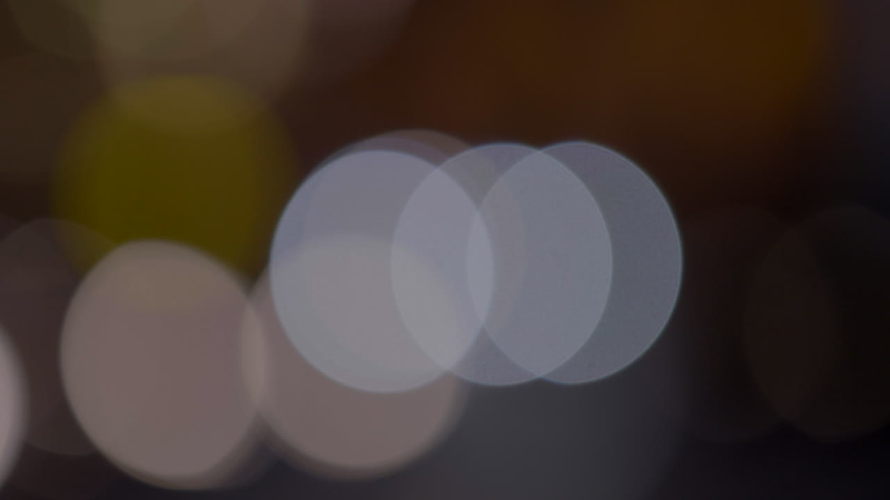 Stylish Bokeh of Lights. Car Lights Out of Focus at Night. Abstract Background.