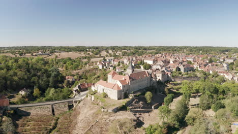 Aerial-drone-point-of-view-of-the-town-of-Saint-Benoit-du-Sault-in-Indre,-France