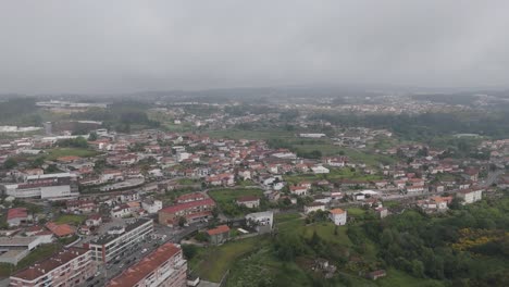 aerial wide view of vila das aves portugal under overcast sky with scattered houses and fields