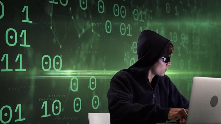 Animation of caucasian male hacker over binary code on green background