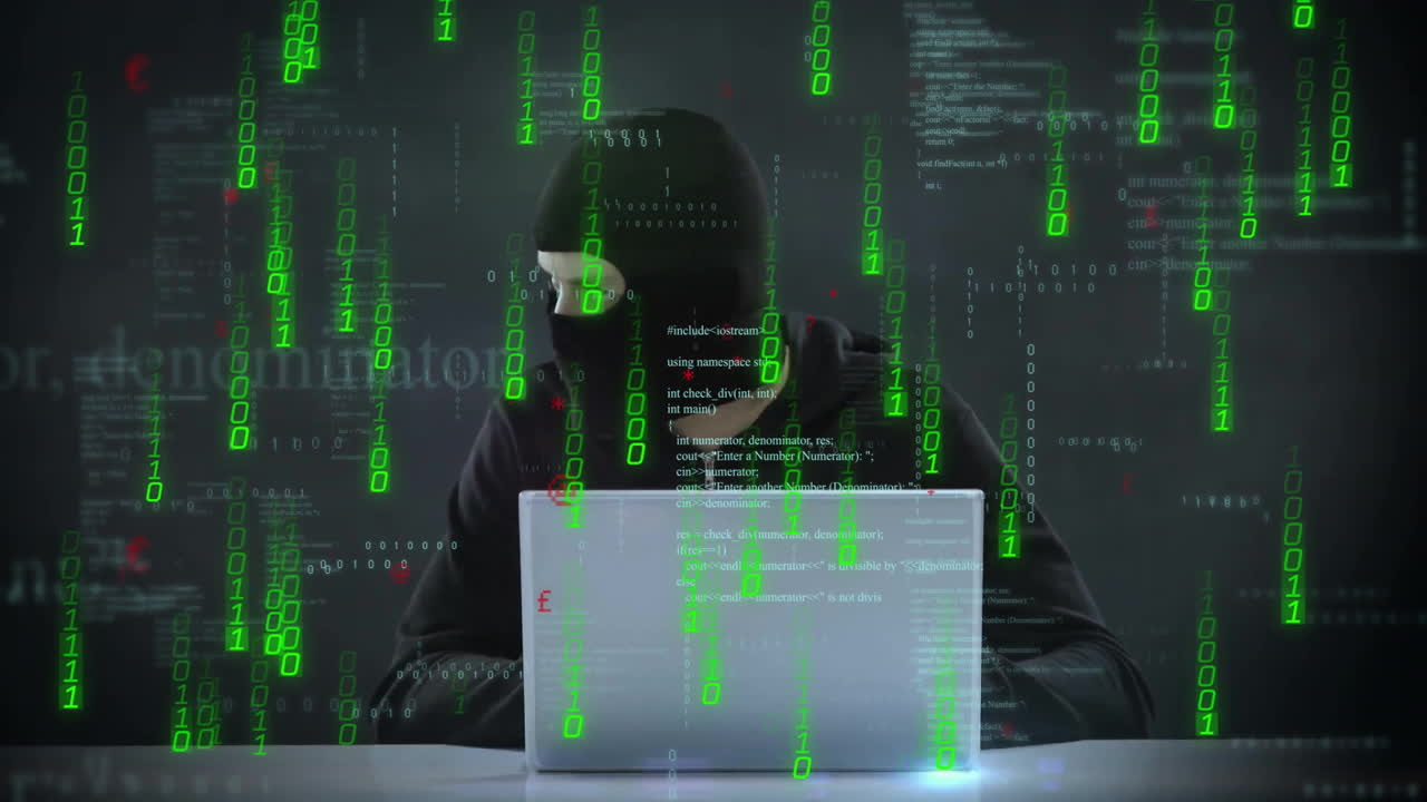 Hacker working on laptop with green binary code animation over dark background