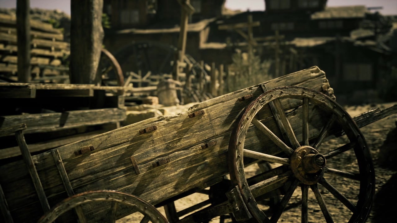 Old wagon wheel weathered wagon wheel with rusted rim in dusty yard