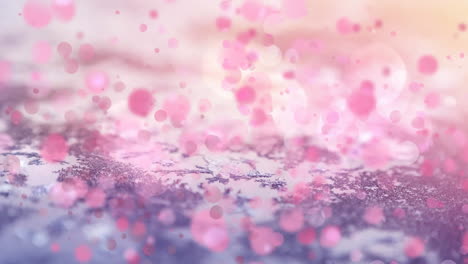 digital composition of pink spots of light moving against snow landscape with trees