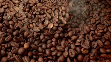 close up of seeds of coffee. fragrant coffee beans are roasted smoke comes from coffee beans.