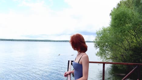 woman enjoying the view of the lake