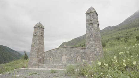 ancient stone monument in mountain valley