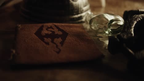 medieval viking leather book with a rune on it