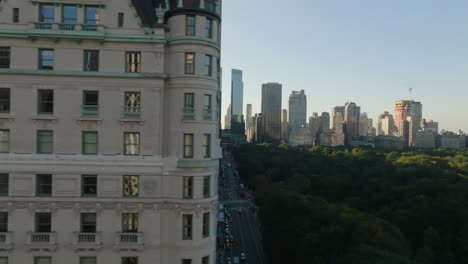 aerial tracking shot of traffic on the west 59th street, golden hour in new york