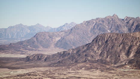 aerial view of a mountain range in a desert landscape