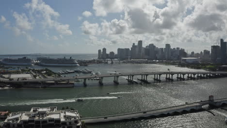 Aerial-view-of-Miami-bridge-near-Biscayne-Island-with-cityscape-and-luxury-boats