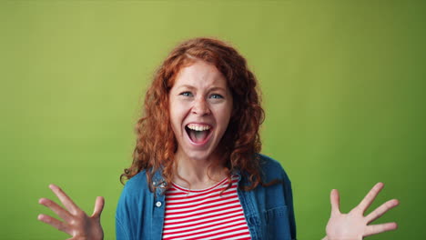 excited young woman with red curly hair