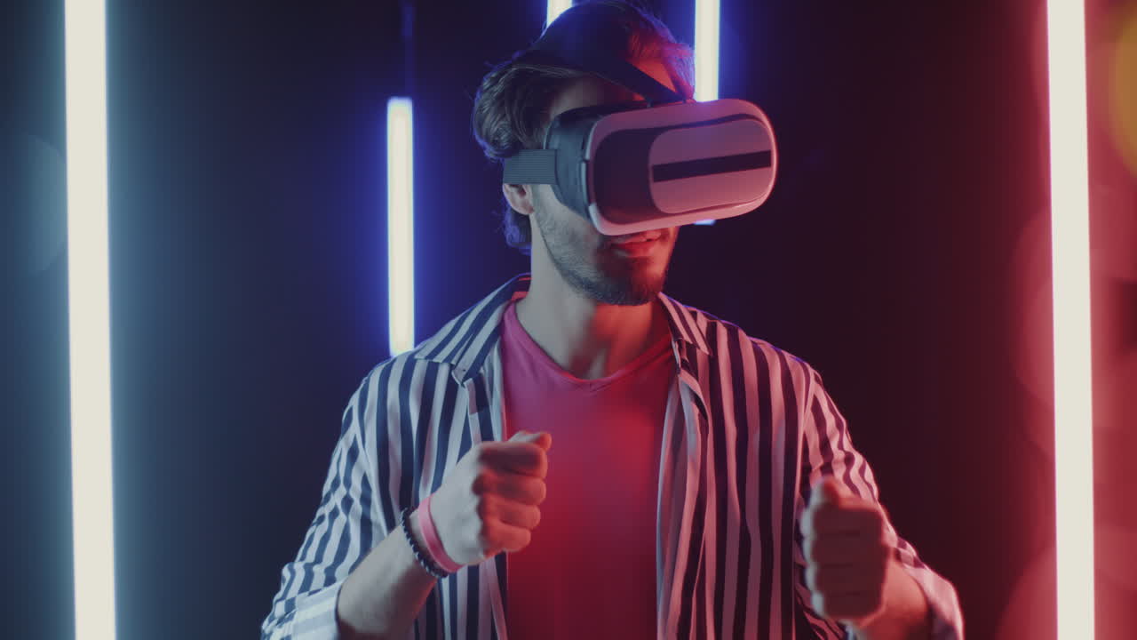 Man Experiencing Virtual Reality Headset with Neon Lights