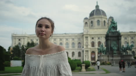 young woman in front of museum building