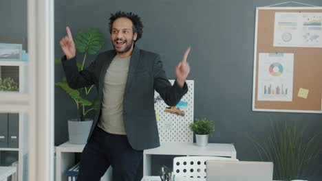 happy man dancing in office