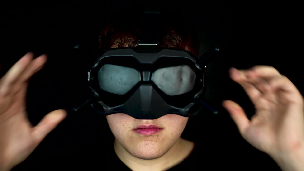 Portrait of Young Man Wearing VR Goggles Virtual Reality Headset