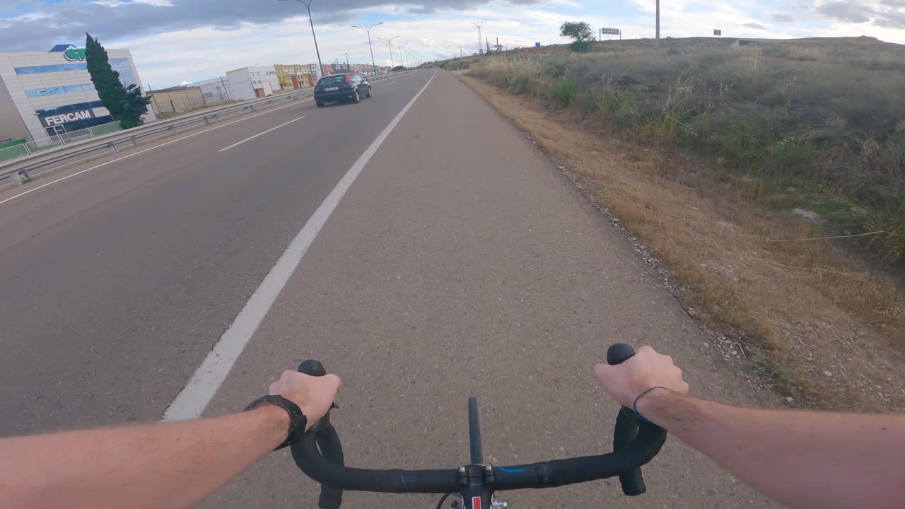 Point of view of an athlete training on the roadside of a secondary road in Spain