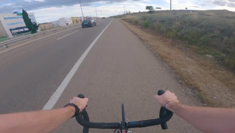 point of view of an athlete training on the roadside of a secondary road in spain