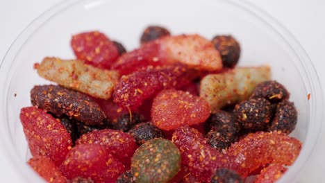 assorted chilli chamoy candy on a lazy susan