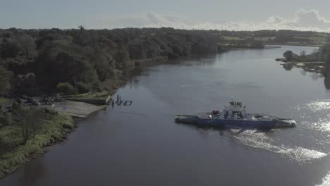 fitzgerald ferry motors across kings channel river suir to the island