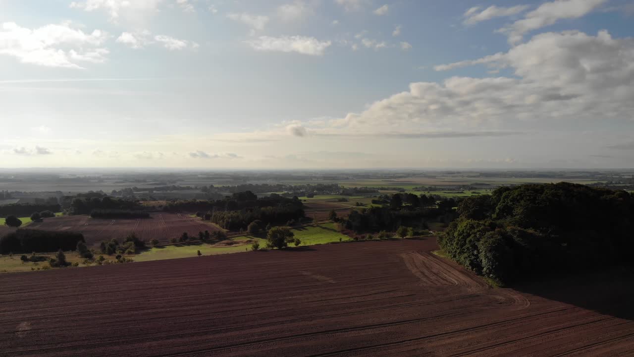 Aerial view of fields with brown mold close to Sejerøbugten in Odsherred