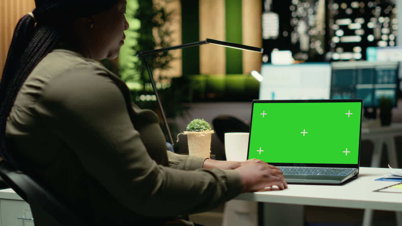 Isolated mockup on laptop at desk with business associate working on research