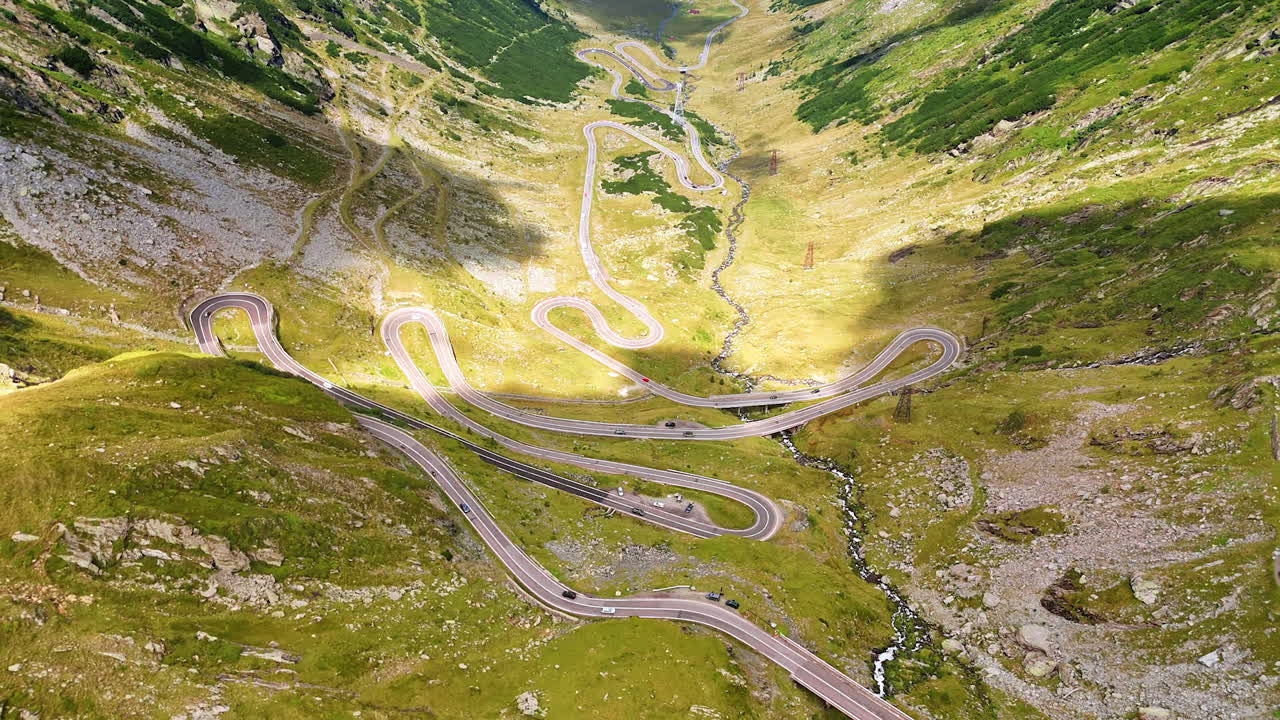 View on the famous Transfagarash highway with cars moving by. Landmark of Romania, in the Carpathian Mountains