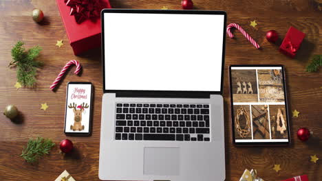 laptop with copy space on screen, with smartphone,tablet and christmas decorations