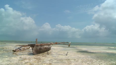 a romantic tropical island paradise shot with an outrigger canoe on the beach