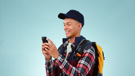 Backpack,-travel-and-man-with-phone-in-studio