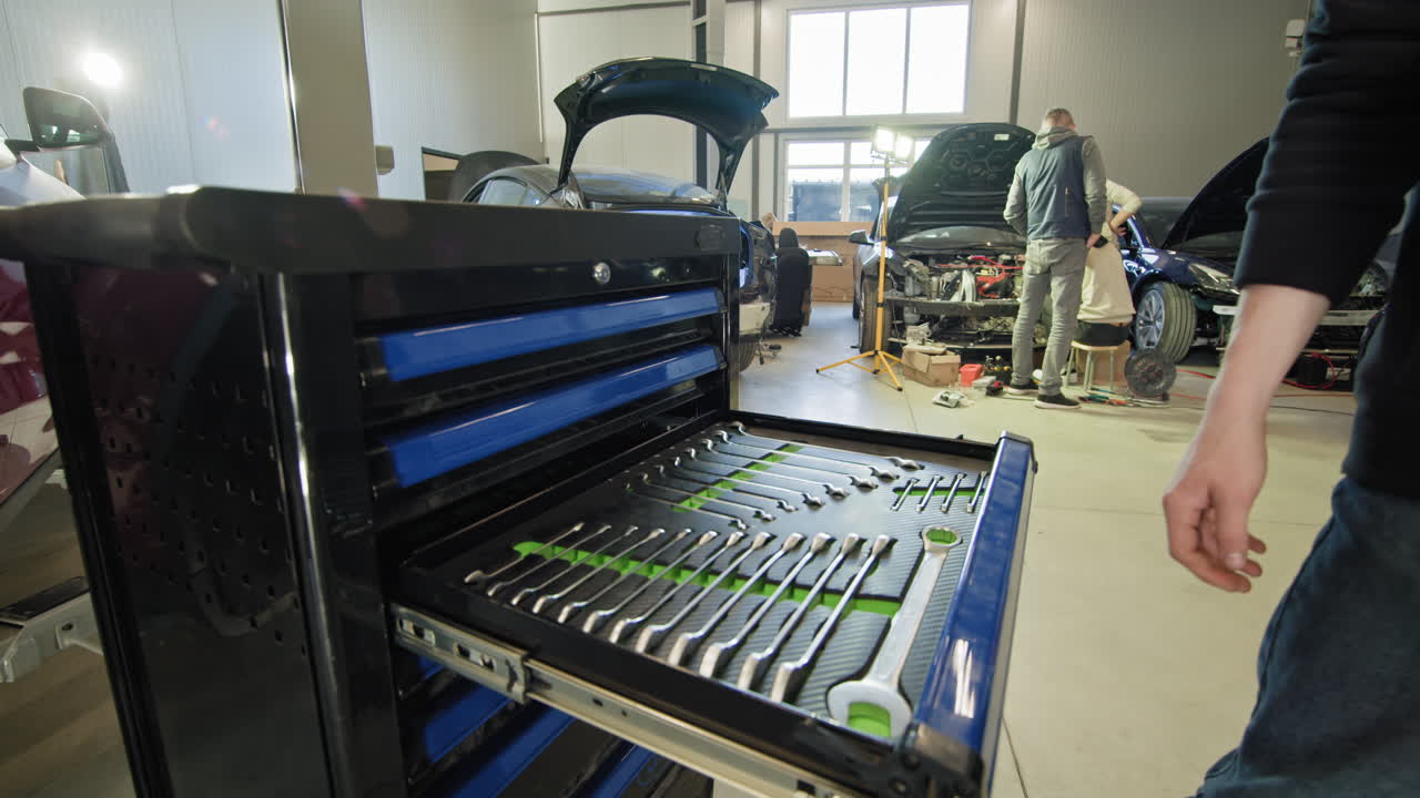 Car repair shop with tools and mechanics