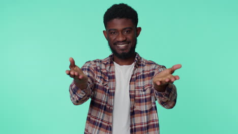 smiling african american man makes heart gesture demonstrates love good sign feelings and sympathy