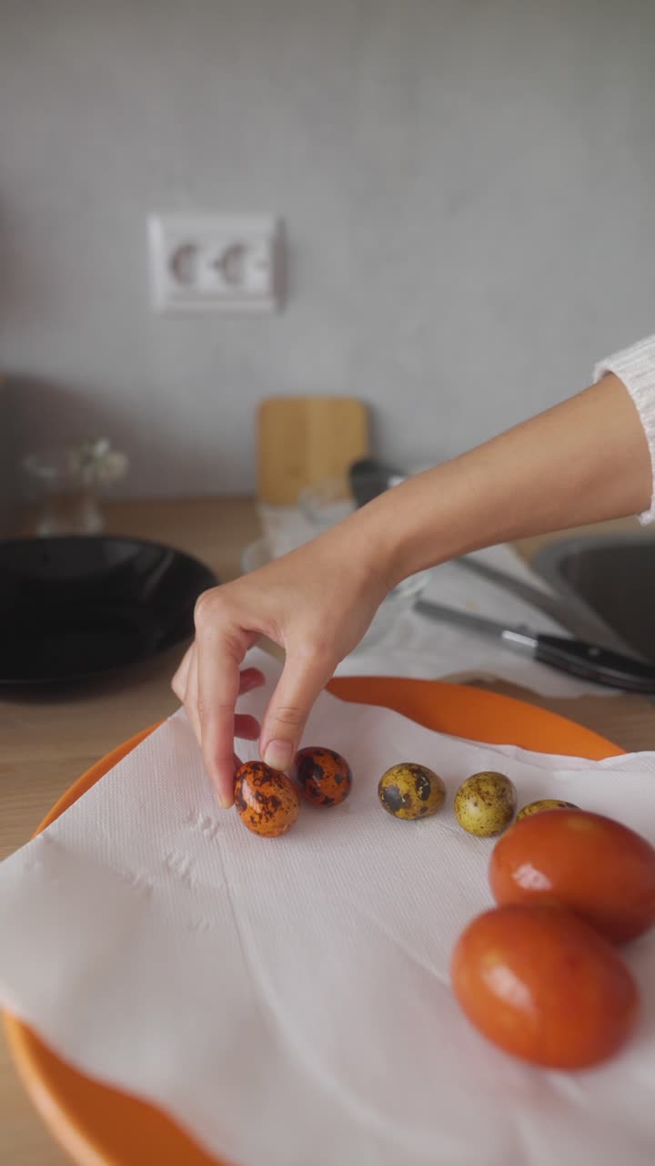 Woman washing dishes and preparing food in a kitchen