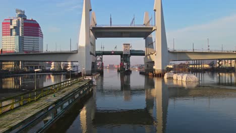 lilla bommen behind hisingsbron and gotaalvbron bridge over gota alv river in gothenburg, sweden