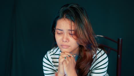 Sadness-creeping-into-young-north-east-indian-teenage-girl,-closeup-portrait-shot