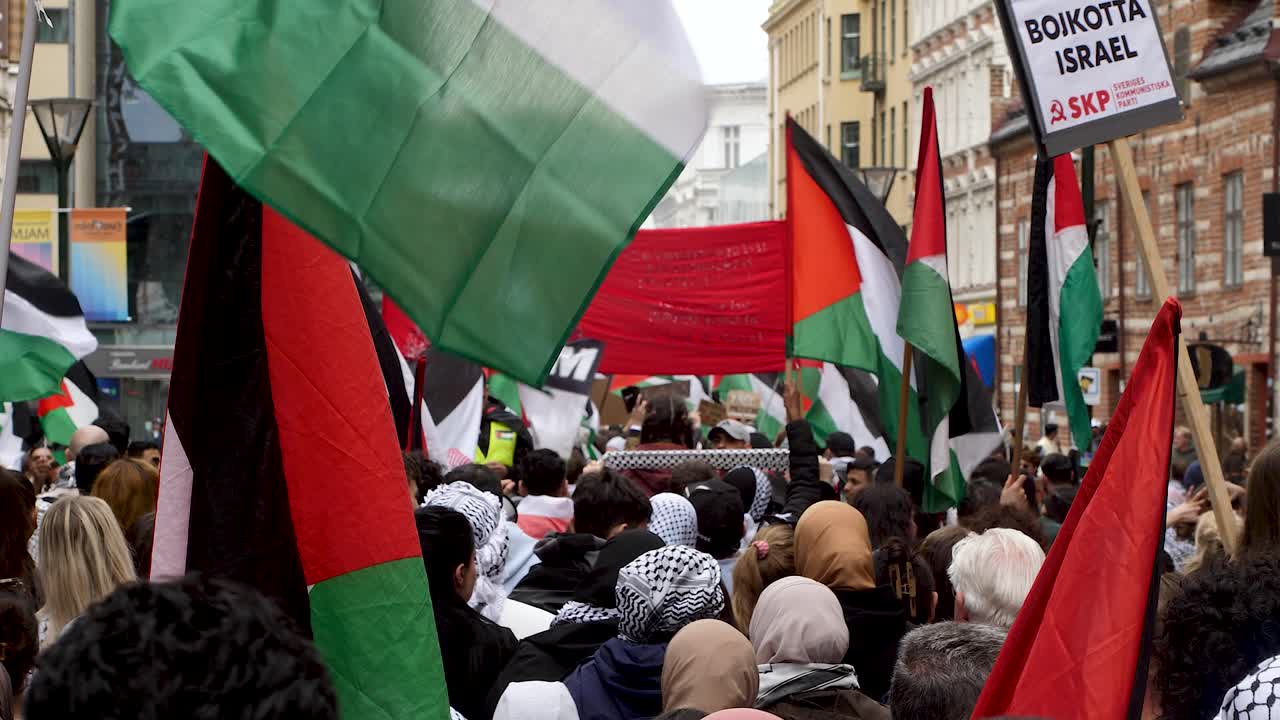 Pro Palestine protesters march against Israel’s Eurovision participation in Malmö (Sweden), calling for a ceasefire on the war in Gaza, Eurovision song contest 2024, medium handheld shot