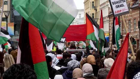 pro palestine protesters march against israel’s eurovision participation in malmö (sweden), calling for a ceasefire on the war in gaza, eurovision song contest 2024, medium handheld shot
