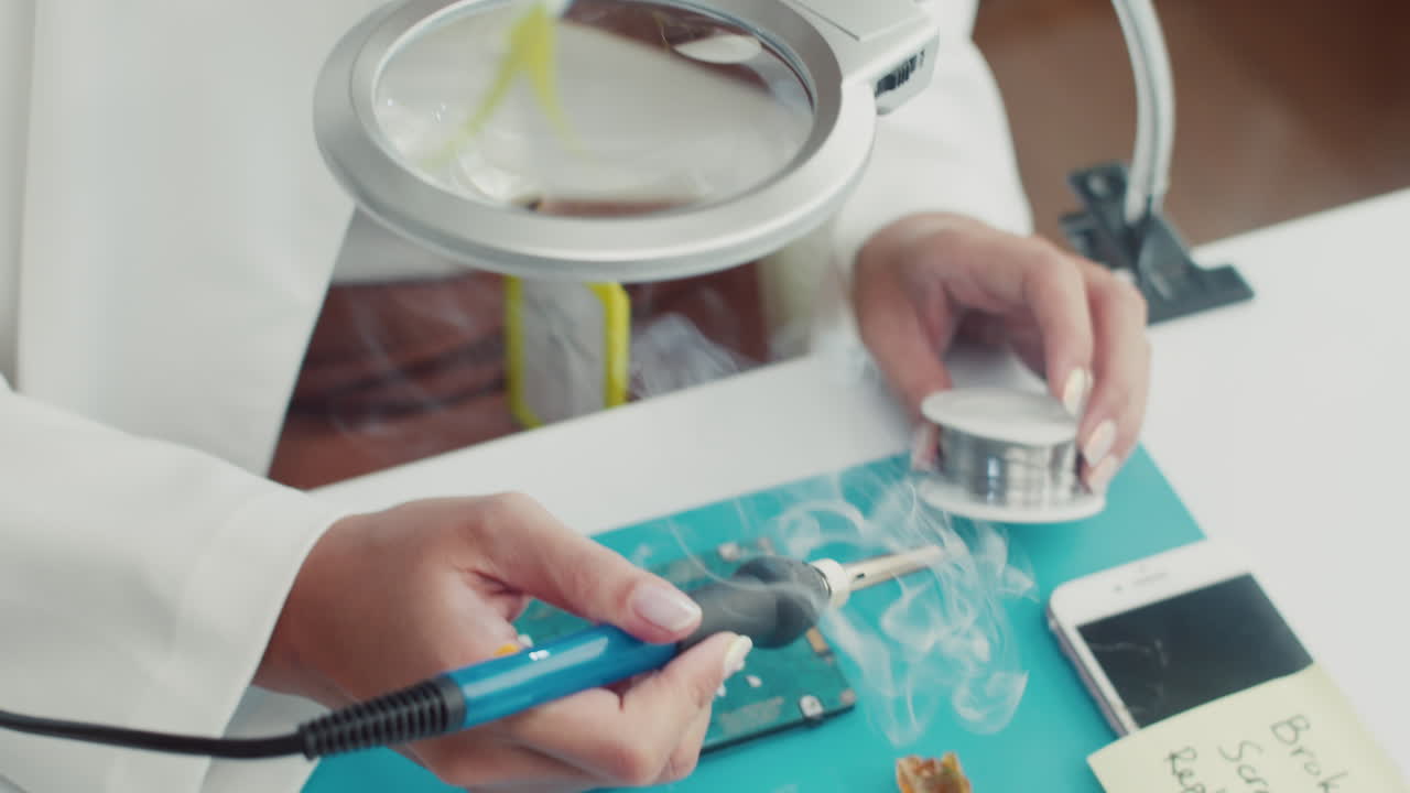 Specialist Working on Electronics Component Repairing