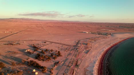 Aerial-view-of-Bahia-Inglesa-beautiful-coastline-with-Atacama-desest-in-Background,-Chile