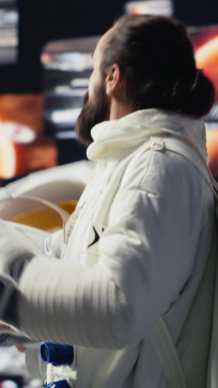 Vertical Video Cosmonaut in a space suit exploring the world above Earth