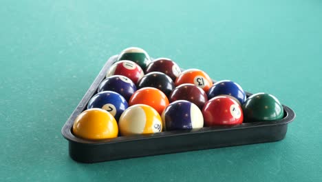 pool balls in a triangle rack on a pool table