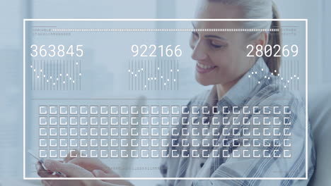 animation of graphs, changing numbers, loading squares, caucasian woman using laptop and cellphone