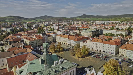 Litomerice-Czechia-Aerial-v5-drone-flyover-Peace-square-at-town-center-capturing-well-preserved-historical-buildings-on-narrow-streets-and-hillside-landscape---Shot-with-Mavic-3-Cine---November-2022
