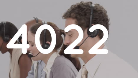 animation of numbers changing over people wearing phone headsets