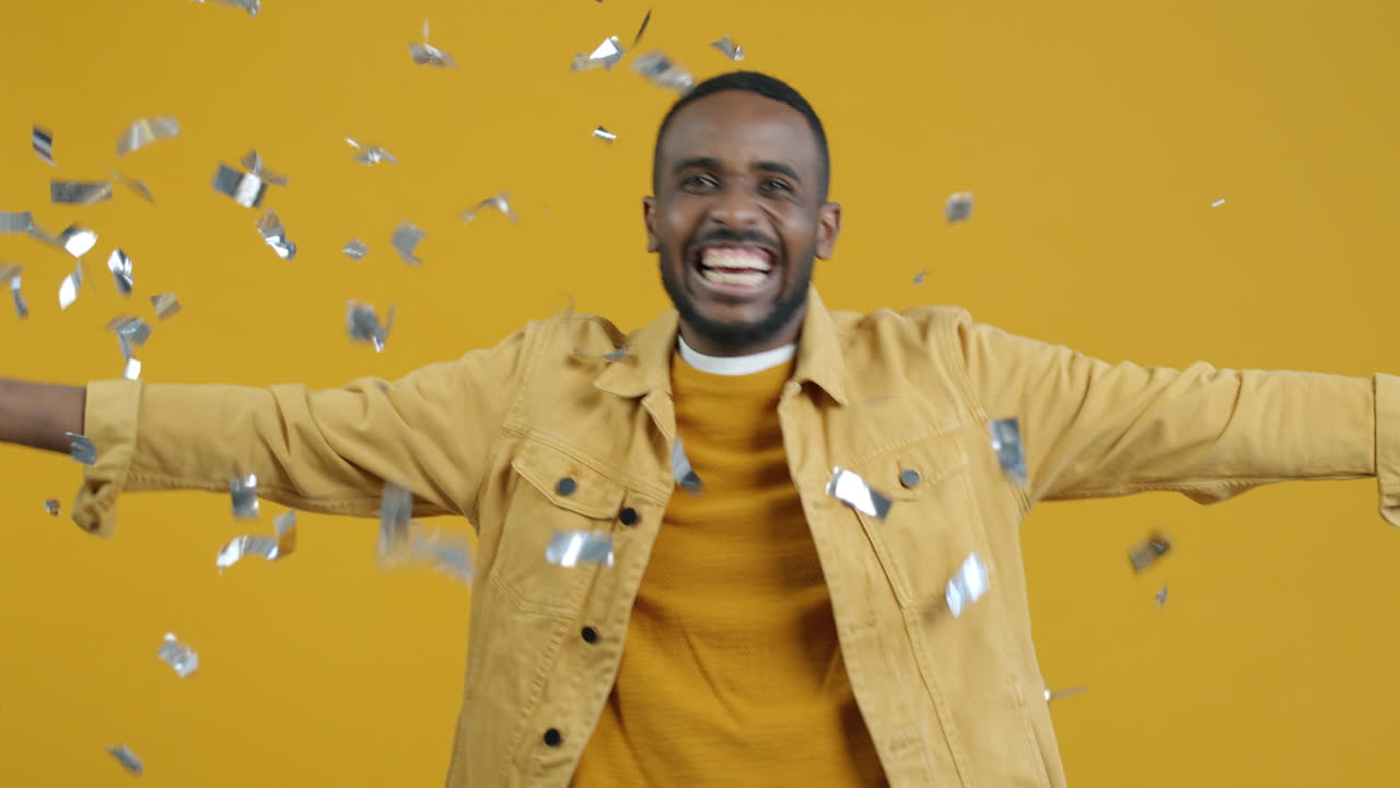 Happy Man Celebrating with Confetti